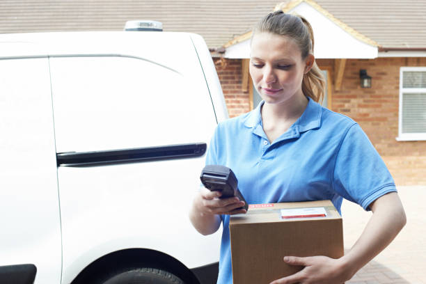istock Female Courier Delivering Package To Domestic House 683792726