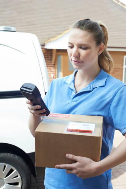 istock Female Courier Delivering Package To Domestic House 683792826