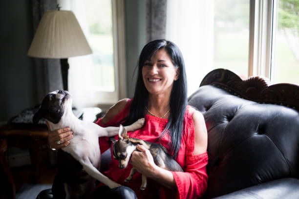 istock A woman with her dog on a sofa 683796674