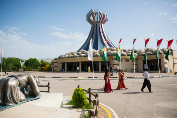 Sirius, Russia - August 25, 2022: View of the Sirius Arena and the decorative and sculptural composition The Wall of the Champions of the Games on the Medal Square in the Olympic Park - panorama