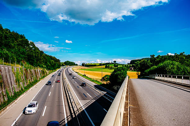 istock Vehicles On Road Along Landscape 683797239