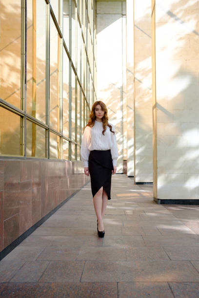 istock Elegant lady walking alone in the street 683799302