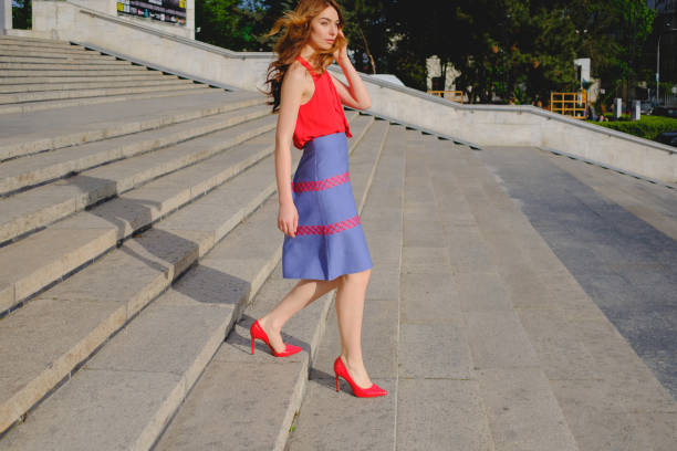 istock Elegant lady walking alone in the street 683801738