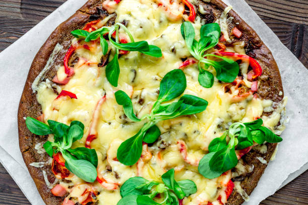 istock vegetarian pizza on wooden table background top view 683802284