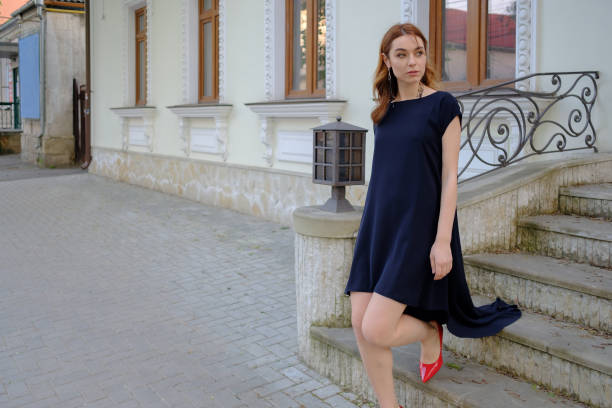 istock Elegant lady walking alone in the street 683802286