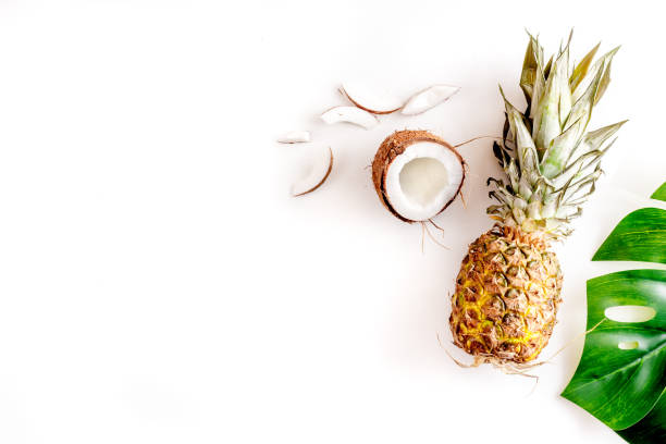 istock summer mix with pineapple and coconut white background top view mockup 683805164