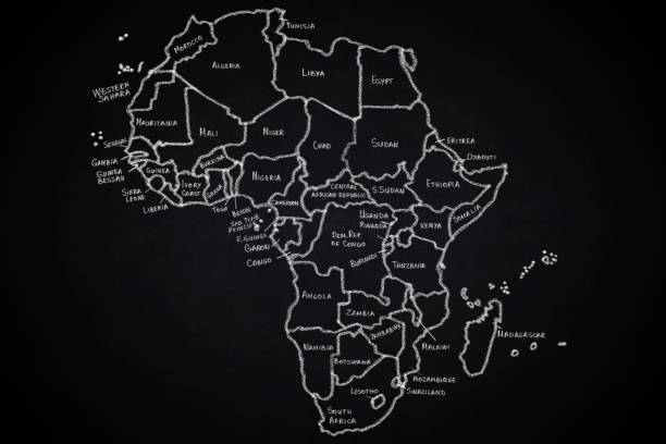 Africa map cut out of colored glass and isolated in black.