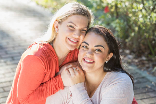 istock Young lesbian couple in the park 683821248