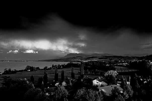 istock Houses On Field Against Cloudy Sky 683827599