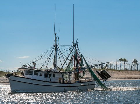 Shrimp boat leaving for the Gulf for a day of shrimping