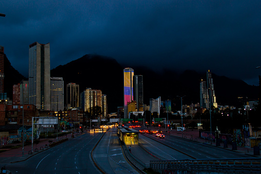 BOGOTA,COLOMBIA-JUNE 26,2016: Cityscape at night time of buildings and streets of Bogota,Colombia. On the Background the Colpatria Tower Building is iluminated with led lights.