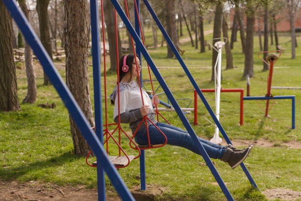 istock Young woman on a swing 683844438