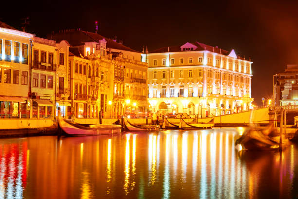 istock Vouga river with traditional boats, Aveiro at night 683860372