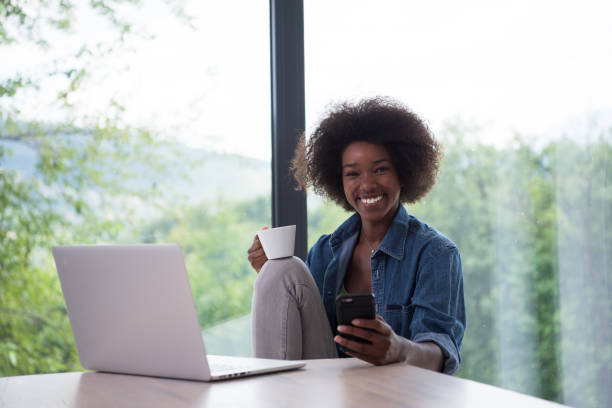 istock African American woman  using laptop at home 683867272