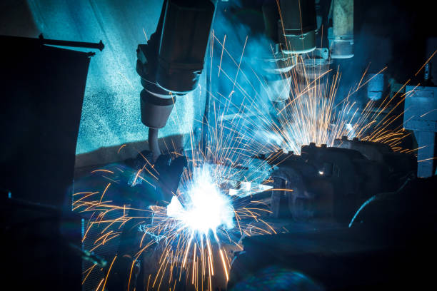 istock Welder robots movement in a car factory 683869836