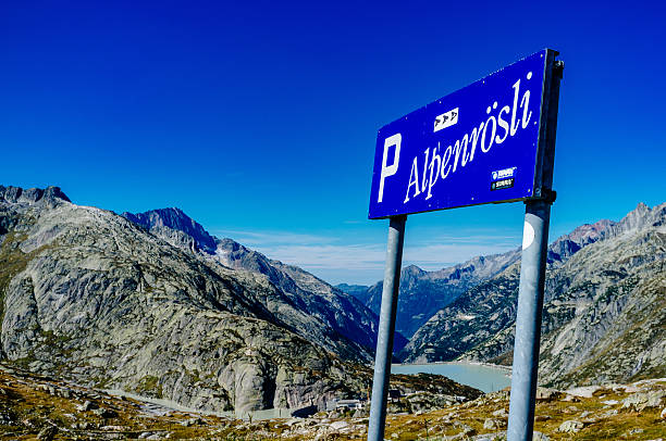 istock Road Sign At Mountain Against Blue Sky 683870443