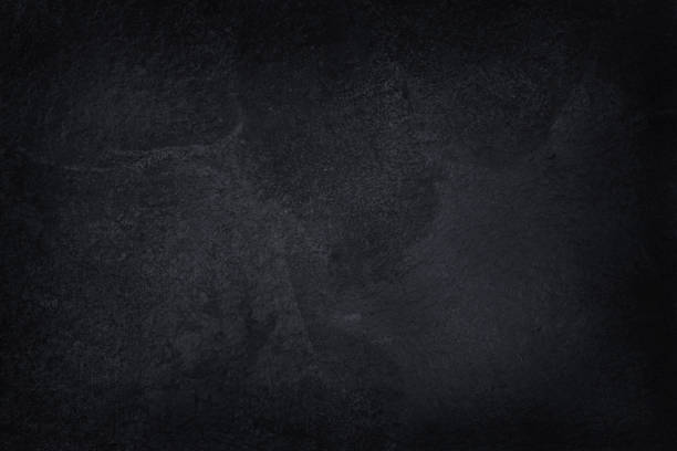 Dark gray black slate natural pattern for background and design art work. Black stone texture background.