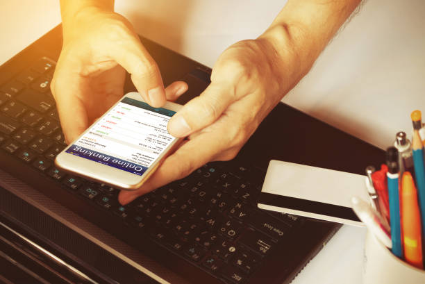 istock Man's hands using smartphone for online banking on the desk in the office or home. 683882472