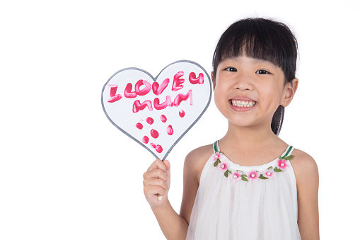 Asian Little Chinese Girl holding greeting card for mother's day in isolated white background