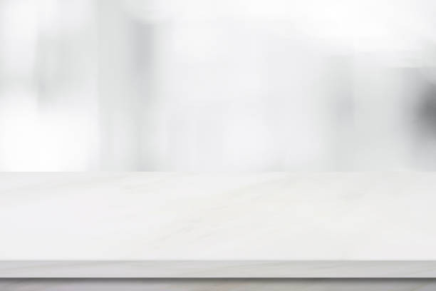 istock Empty white marble over blur store background, product and food display montage 683885674