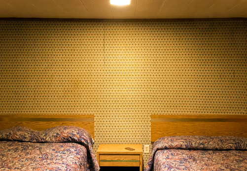 An empty and dated motel room in Kentucky.