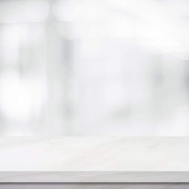 istock Empty white marble over blur store background, product and food display montage 683888706