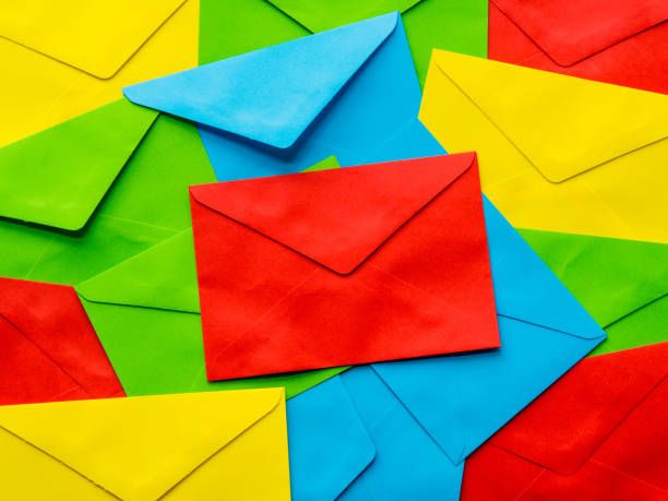 istock colorful cover letter background. Multi colored envelopes and letters as a background 683891024