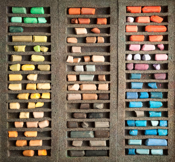 istock Set of used pastel sticks in a box background 683894208