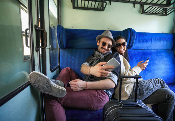 istock Couple using smart phones inside of a train 683895340