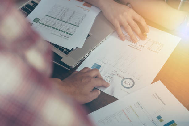 istock Business team two colleagues discussing new plan financial graph data on office table with laptop. vintage filter 683895542