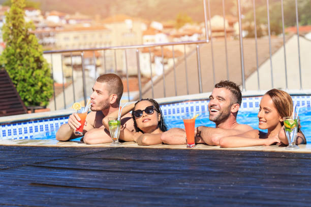 istock Pool party with friends and cocktails 683896710