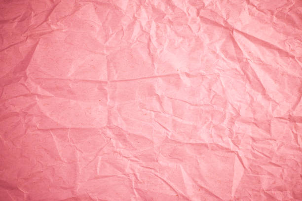 istock Crumpled recycle pink paper background. 683897690