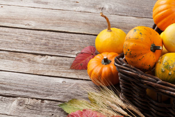 istock Autumn pumpkins on wooden table 683901608