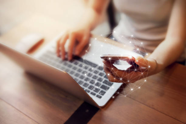 istock Woman hand using mobile phone and laptop, Worldwide connection technology interface. 683907904