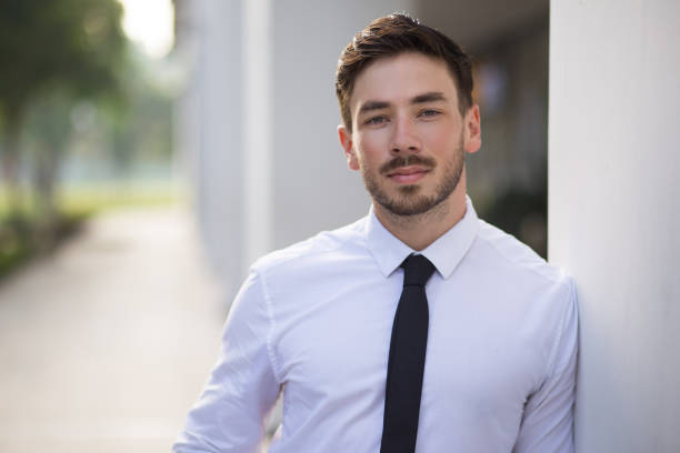 istock Serious young businessman with stubble outside 683911002