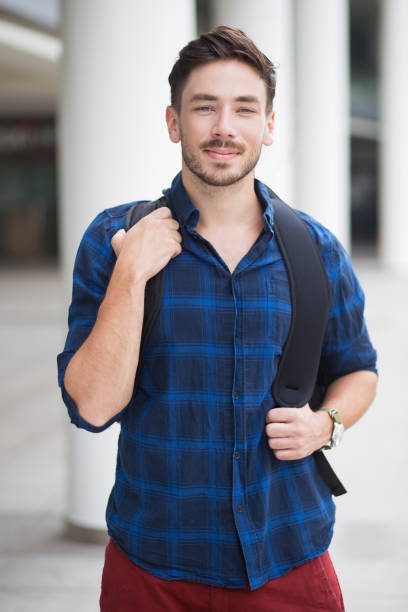 istock Content Attractive Young Man With Backpack in City 683911854