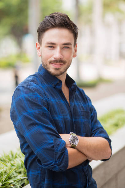 istock Relaxed Handsome Guy Leaning on Flowerbed in City 683911926
