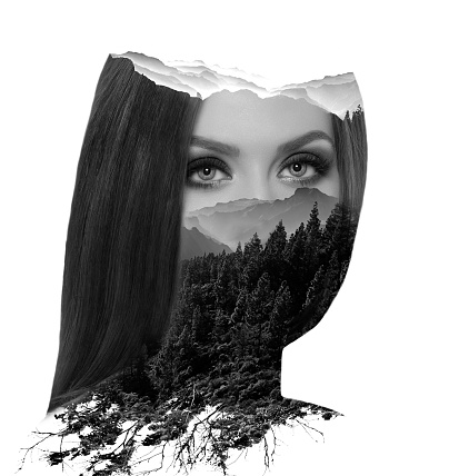 amazing double exposure photography with attractive woman portrait with straight hair looking at camera, double exposure with forest and mountain landscape.