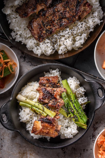 istock Grilled Kalbi, marinated short rib, over Steamed Rice 683915420