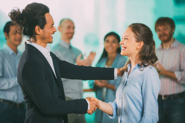 istock Smiling Business Man Congratulating Colleague 683926392