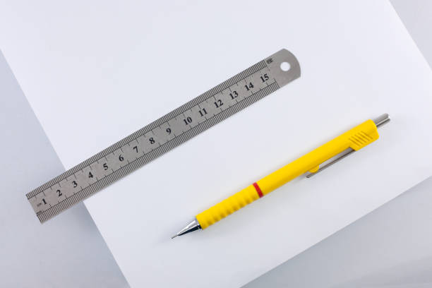 istock stationery - ruler, paper and a pencil are isolated on a white background. 683930152