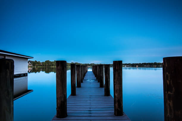 night pier over florida lake stock photo