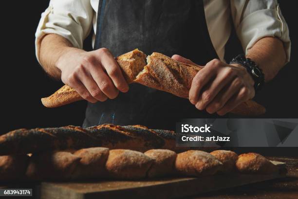 Male Hands Break The Baguette Stock Photo - Download Image Now - Bread, Baguette, Oven