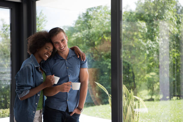 romantic  couple relaxing and drinking coffee at modern home