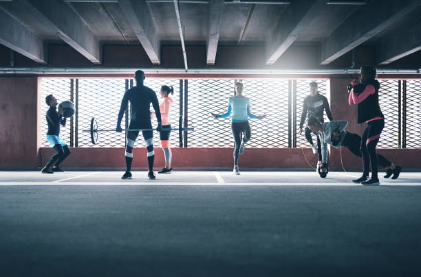 istock Young sportive adults training in gym 683951224