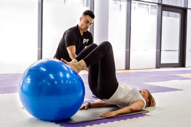 istock Senior woman and trainer 683951442
