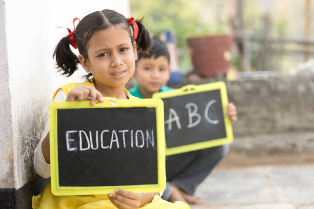 istock Boy and girl holding slate 683955848