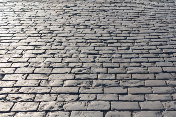istock Pavement background in sunny day, cobblestone 683962150