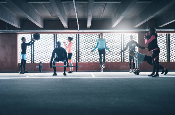Group of people exercising together stock photo