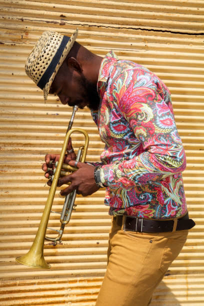 istock African musician playing trumpet 683966424